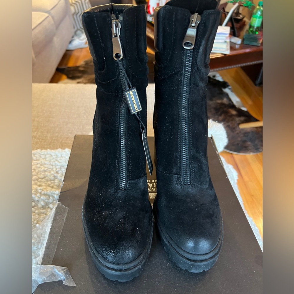 Emanuel Castro black zip boots.